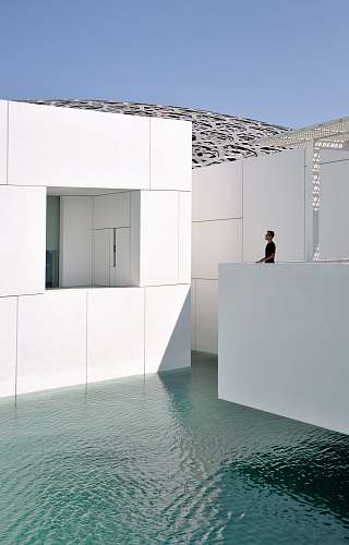 abu dhabi man standing on jacuzzi above body of water furniture
